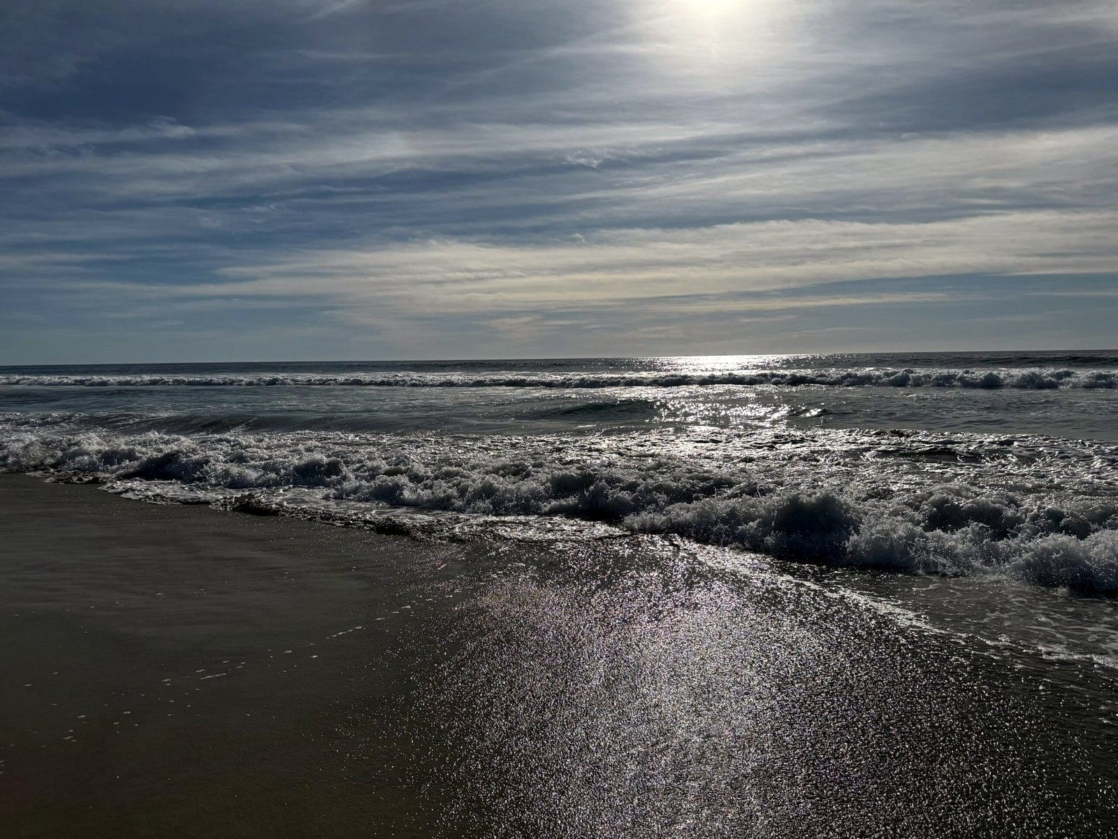 Moonlight on the water and wet sand at Playa Los Cerritos